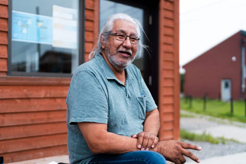 Paul Dixon sitting and looking at the camera.