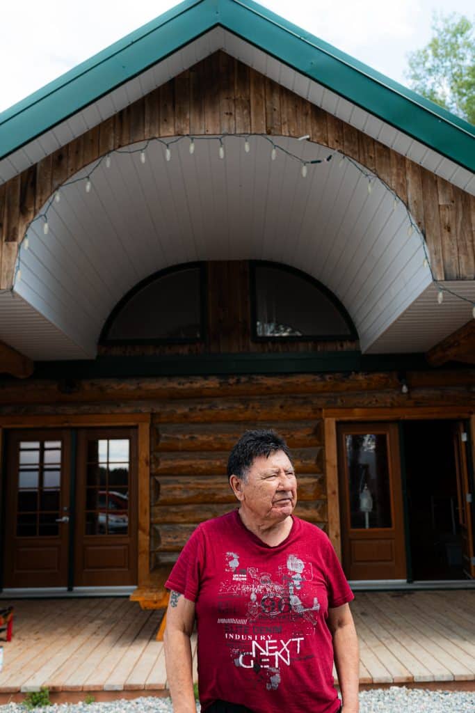 Allan Saganash standing, looking away from the camera.